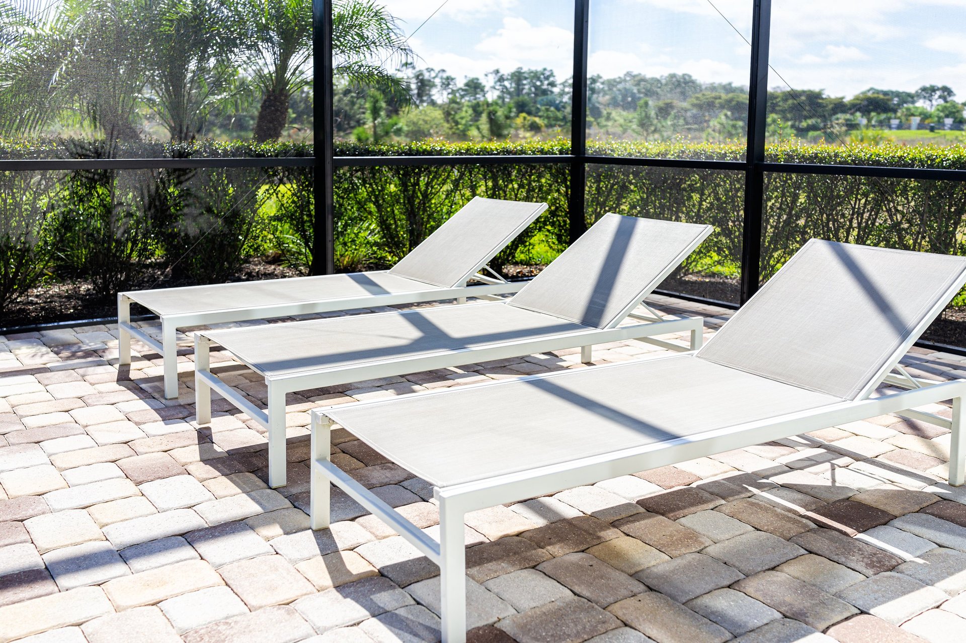 Modern Florida pool cage with lanai