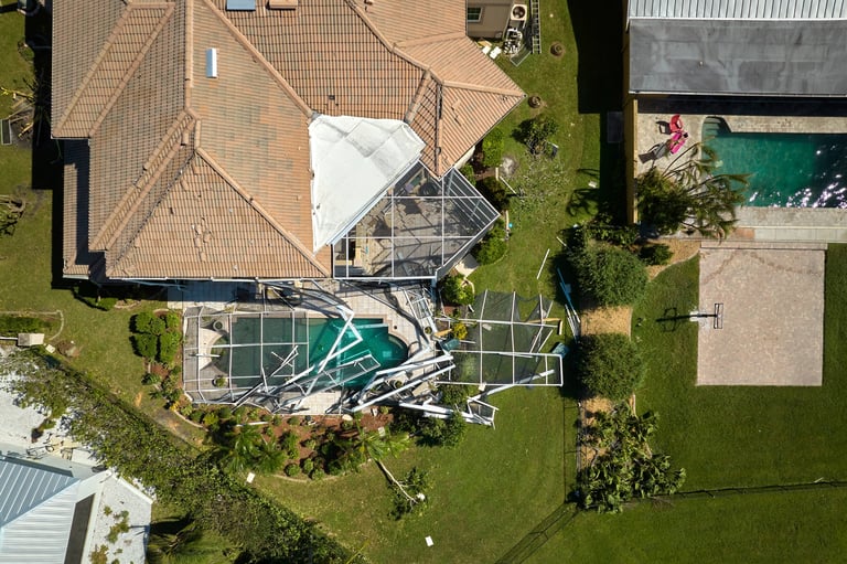 Damaged pool cage after hurricane
